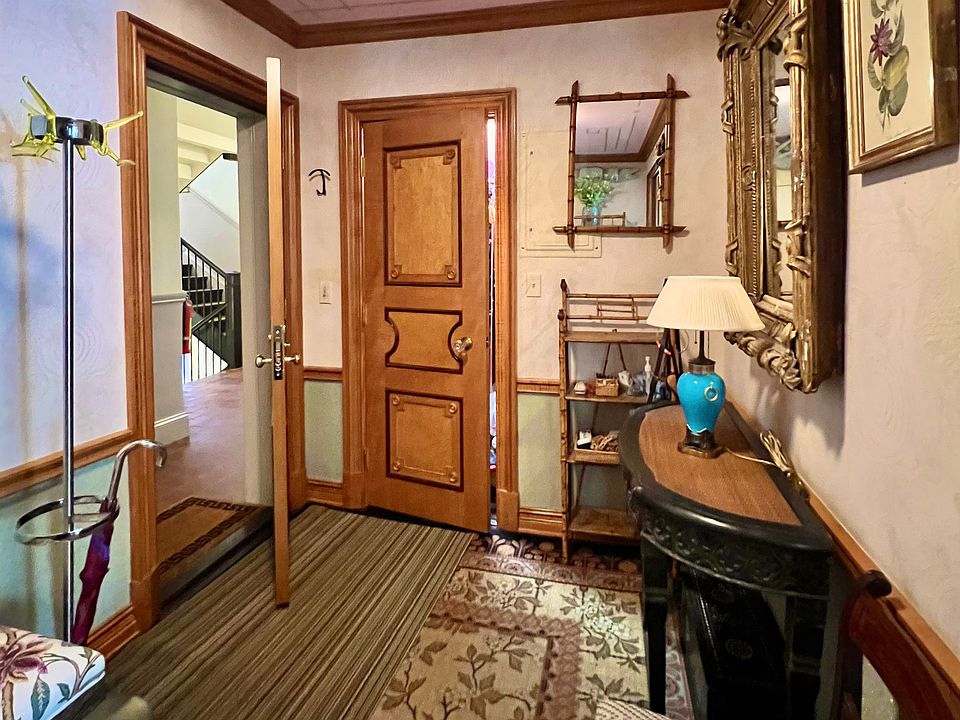 Coat rack and ample closet with lighting and shelves