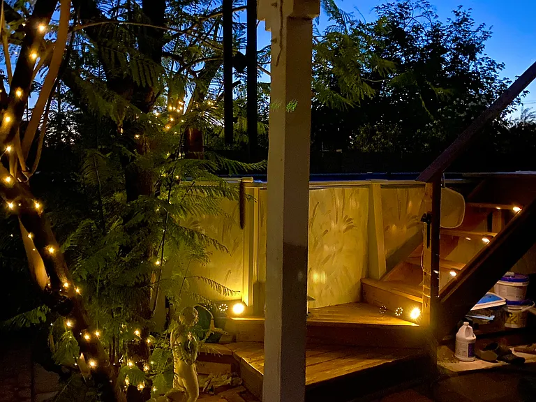 Above ground Pool at night on the patio