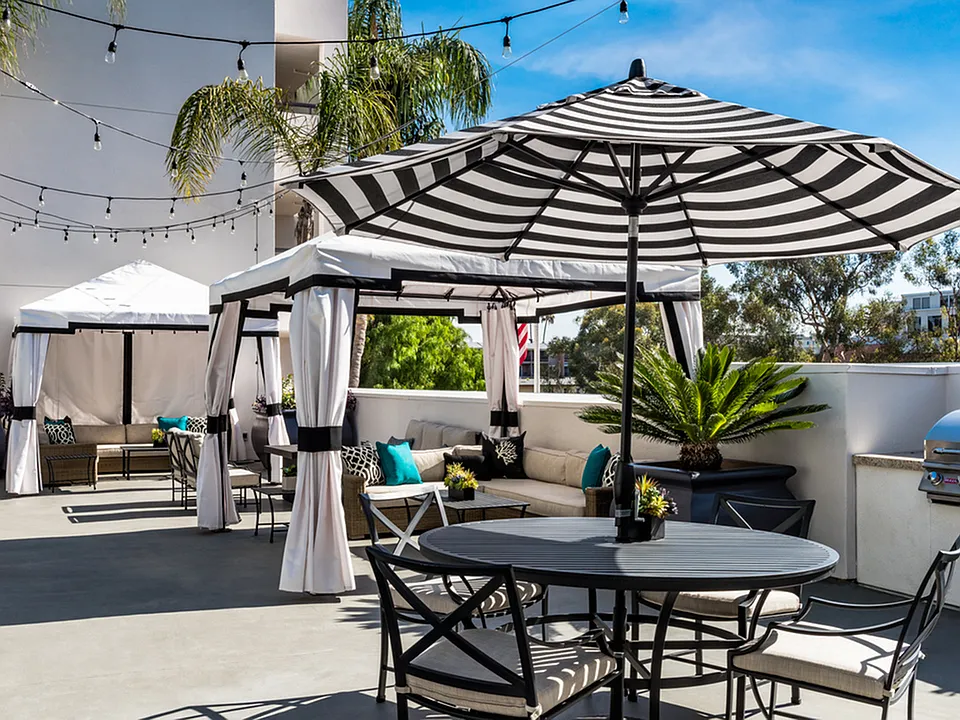 Relax under private poolside cabanas or host friends at the open-air dining patio.