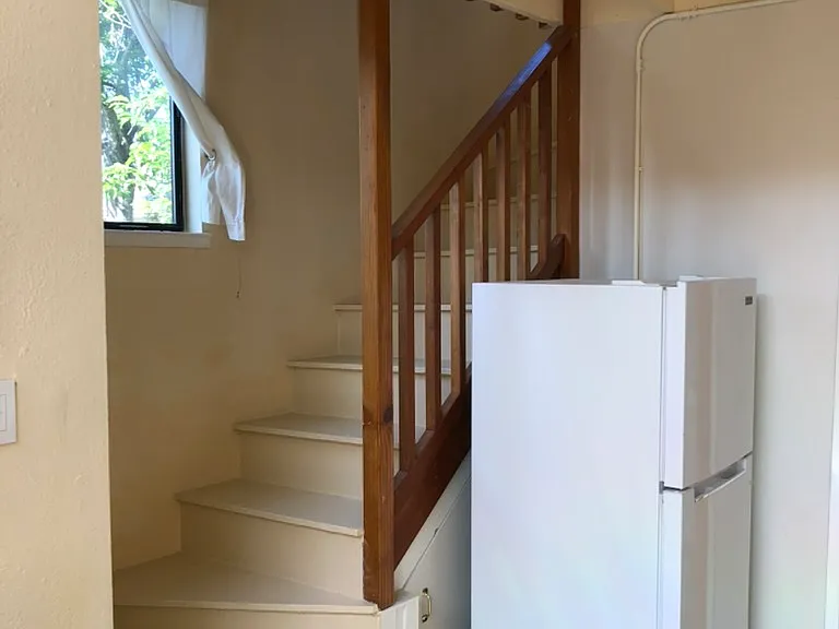 Stairs to bedroom; ful refrigerator