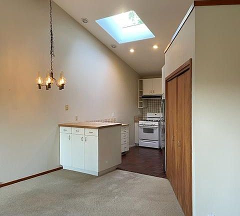 Kitchen w/skylight and 14ft vaulted ceiling