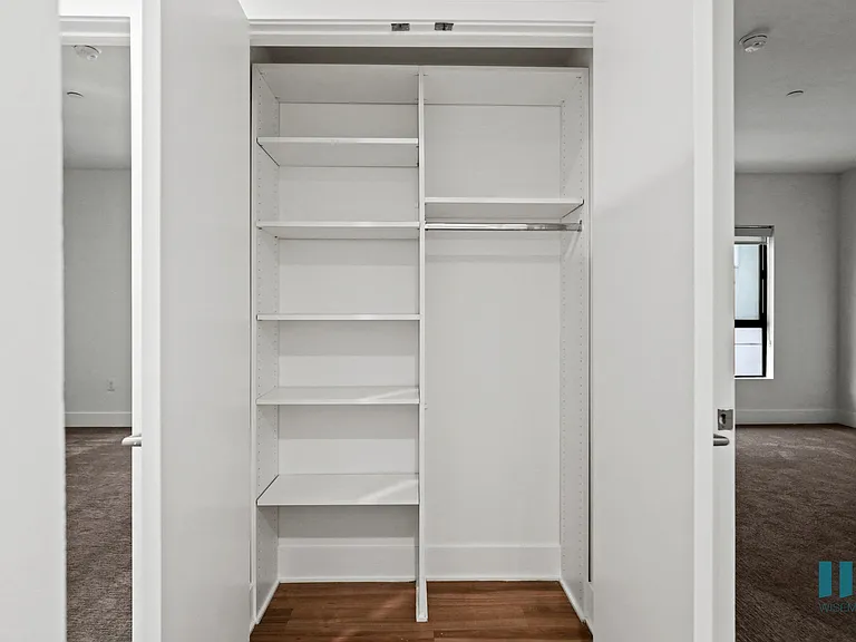 Hall Closet with Built-In Shelving