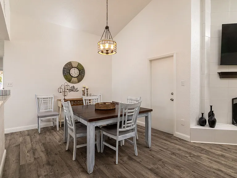 Open-concept dining area able to seat up to 8 people_perfect for family meals or entertaining guests in style.