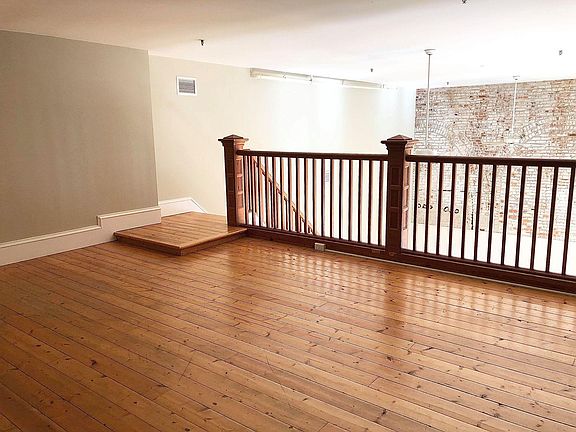 Loft/bedroom area upstairs.