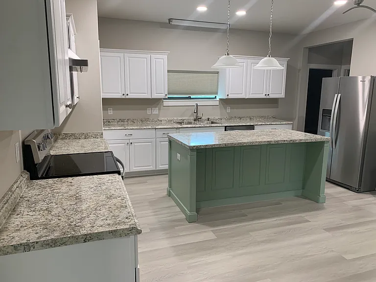 All new 22 Cu. ft. side by side refrigerator, new range and vent hood system, new dishwasher.