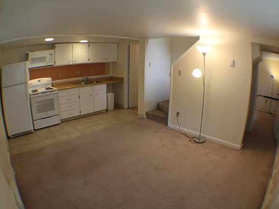 Livingroom and kitchen. Visable door is into bathroom.
