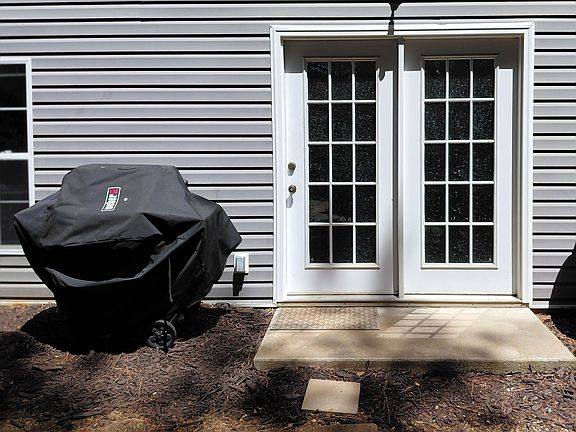 Private entrance with dedicated outdoor access and grill area