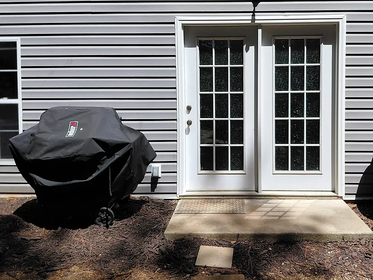 Private entrance with dedicated outdoor access and grill area