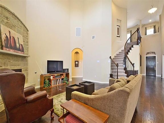 Elegant stair case with iron balusters.