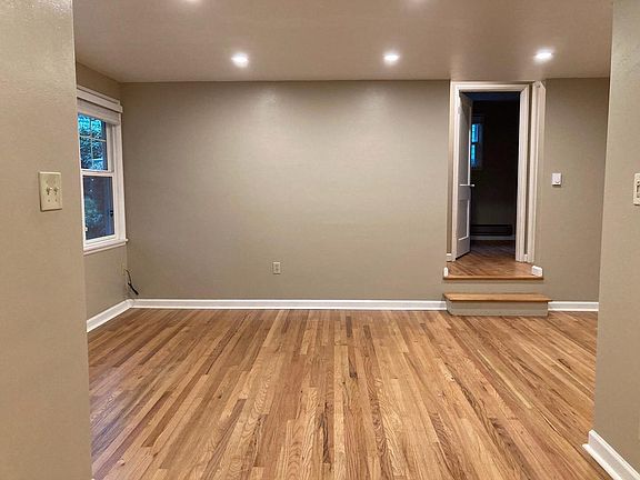 Living room, double pane windows, hardwood floors, fresh paint.