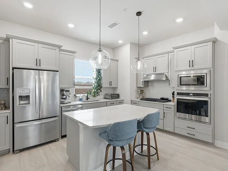Kitchen with gas stove, in-wall oven, extra large island, and walk-in pantry