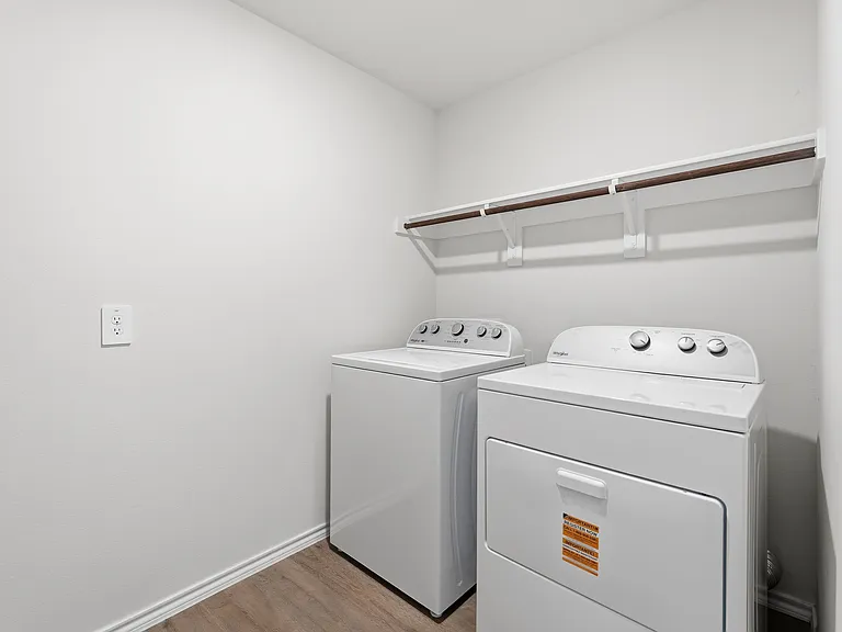 Utility room equipped with washer and dryer