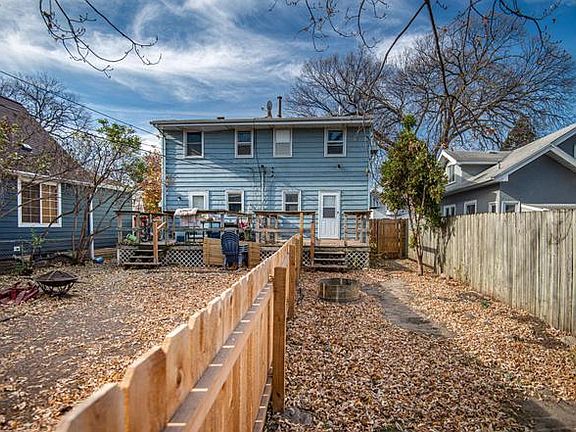 Backyard split with a fence down the middle to ensure privacy and dog separation.