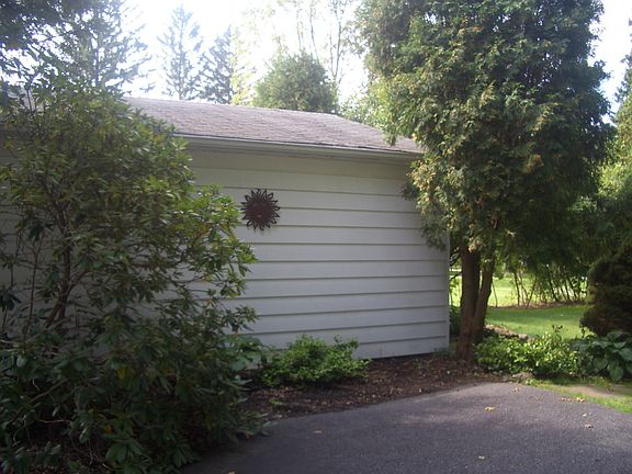 Parking pad next to detached garage
