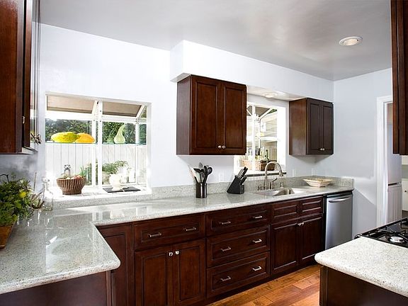 Remodeled Kitchen with granite, beechwood cabinets, & stainless appliances