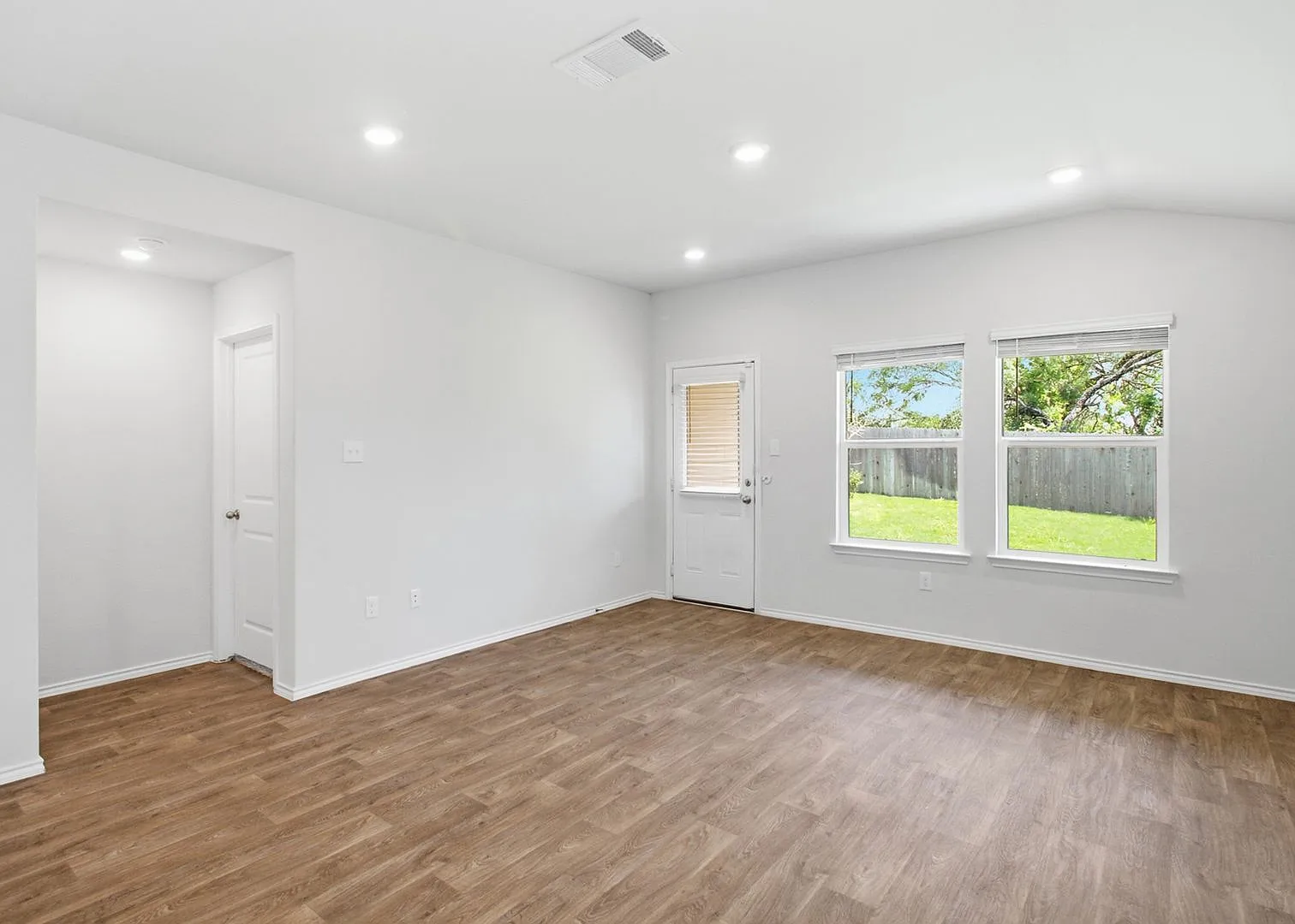 Open-Concept Living with Island Kitchen and Refrigerator Included — Photo 4
