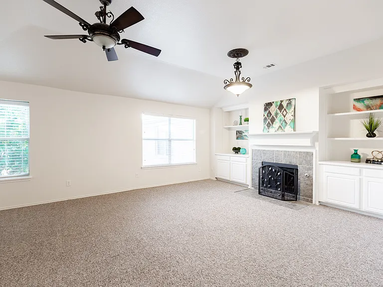 Primary bedroom upstairs with fireplace and sitting area