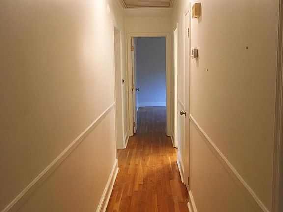 Hallway, with three bedrooms along corridor (one on each end, and Bedroom #2 between)