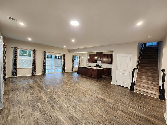 The heart of the home. Enjoy a wide-open view from the kitchen to the dining and living rooms, making it easy to keep an eye on the family while preparing meals on premium granite surfaces.