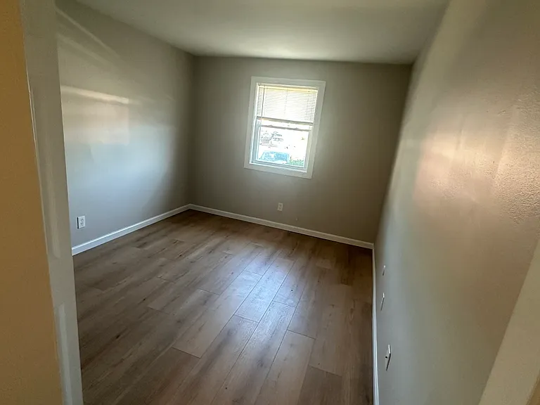Second bedroom with full size closet organizer