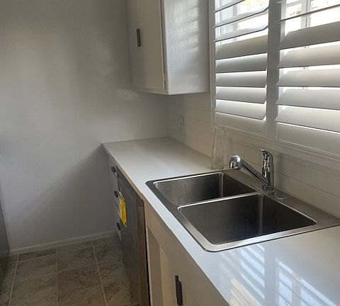 Plantation Shutters throughout
and new counter tops/sink