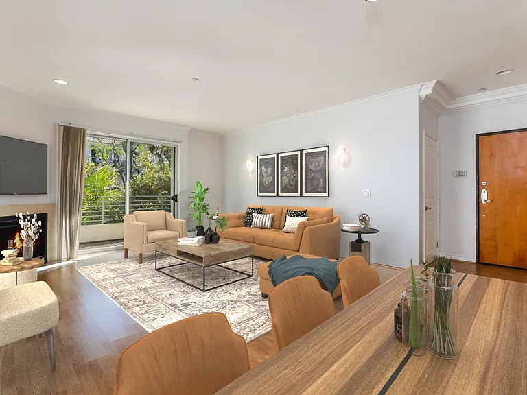 Living room with balcony, fireplace, entry door, virtually staged