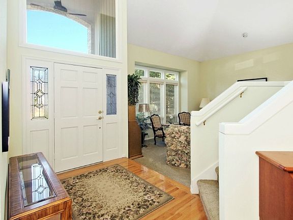 Soaring two story entry with skylights and hardwoods.