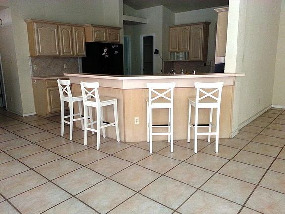 Open Kitchen with Solid Surface Counter Tops