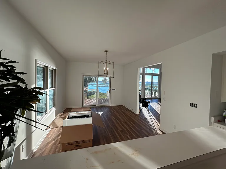 View from kitchen to dining room out to deck.