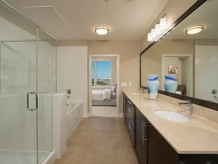 Stunning spa-inspired bathrooms with stand-up glass enclosed showers and soaking tubs, in select homes