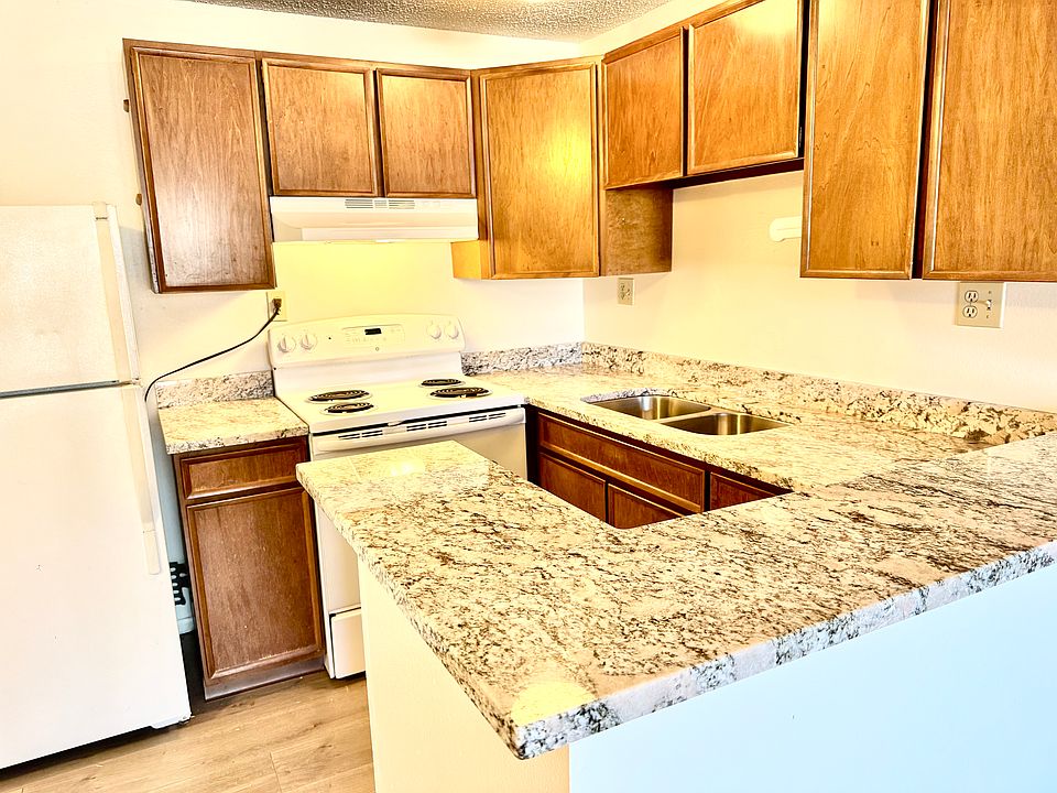 Remodeled kitchen with new granite counters, sink & faucet.