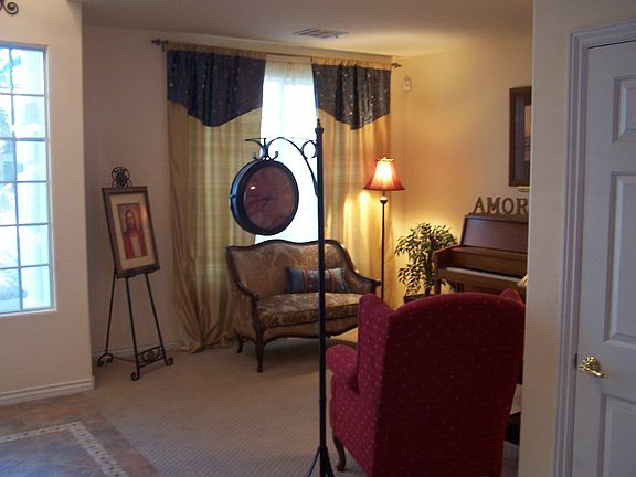 Formal living room just off 2-story entry.  Notice the detailed tile mosaic.