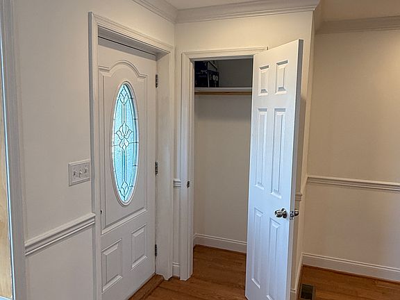 Coat Closet, adjacent to front door