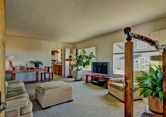 You enter into the living room with high ceiilings.  It's roomy