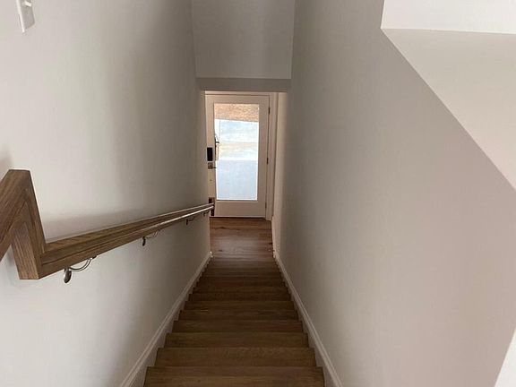 View from the top of the stairs looking back down to the front door