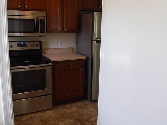 Standing inside laundry room conveniently placed off of kitchen