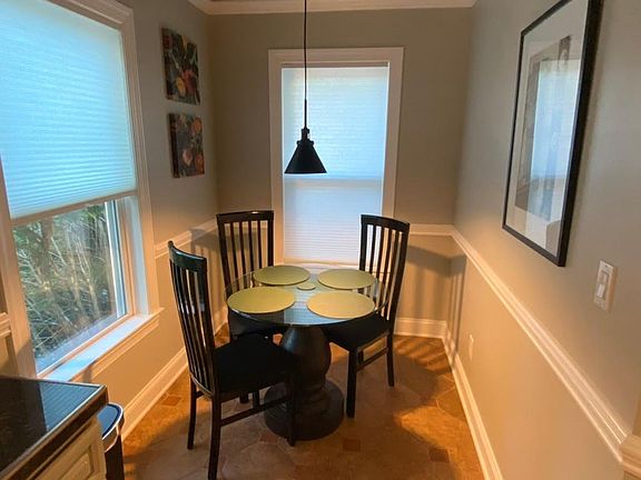 Custom glass-top pedestal dining table with Italian chairs - 4th chair is not pictured, but is provided
