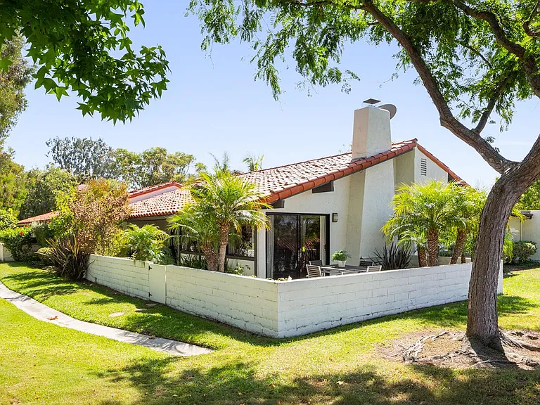 Relax in your backyard surrounded by mature trees.