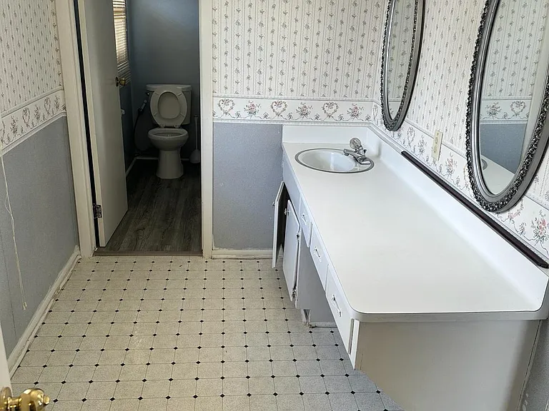 Vanity area connected to Master bedroom, connected to master walk in closet, and bathroom.