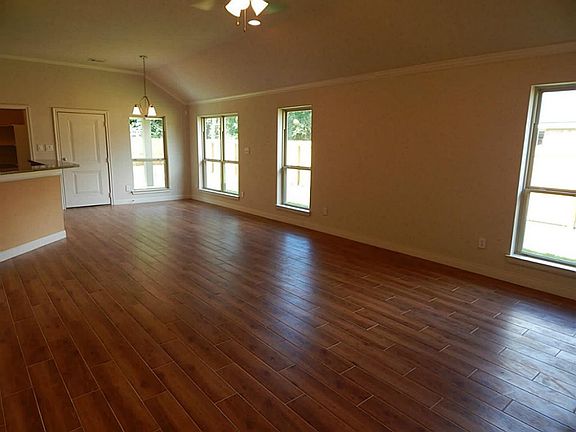 Spacious living area with porcelain tile