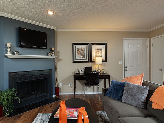 Step into comfort and style with a living room designed for relaxation and productivity.
