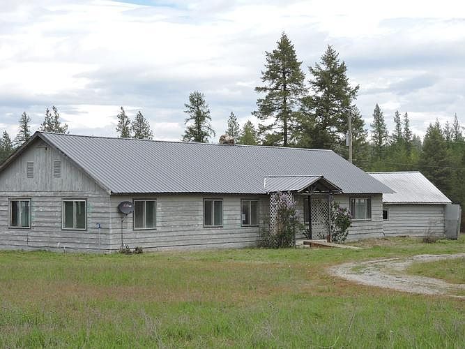 VIEW OF SUBJECT FROM DRIVEWAY ACCESS.