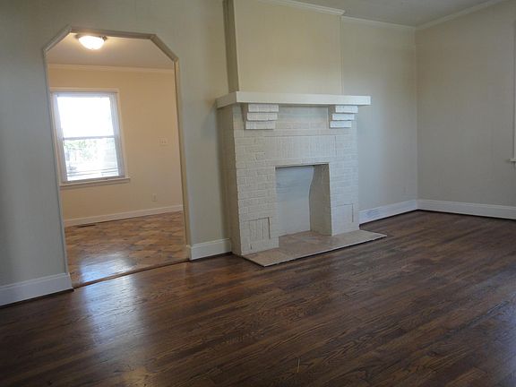 LR with hardwoods & non-working fireplace