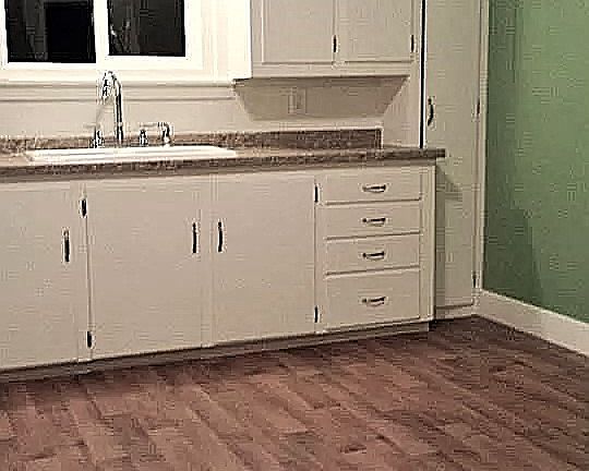 Nice big kitchen with room for a dining room table. Modern countertop, sink and faucet, tons of cabinets!