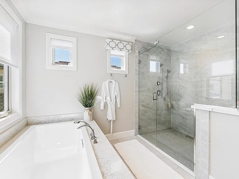 Imagine a bubble bath in this tub then rinse off in this beautiful oversized shower!