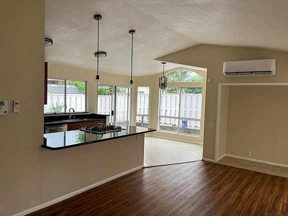From the front door looking into living room, dining area, and kitchen. New mini split AC