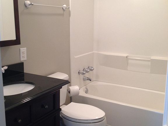 bathroom with tub and shower