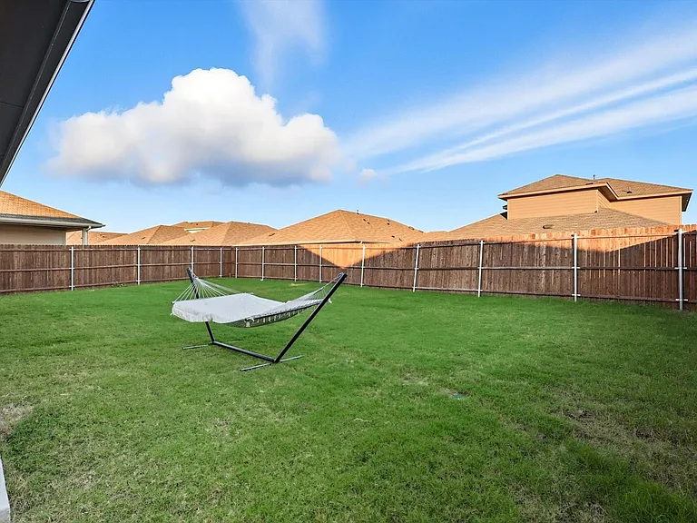 View of fenced backyard