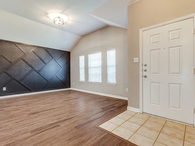 Entry to the formal dining / oversized home office offering lots of bright light
