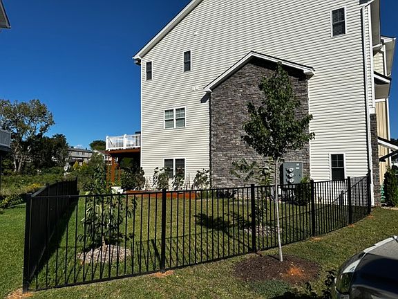 Sunny 2000 sq ft private fenced yard, with fruit trees!
